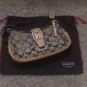 Coach handbag with trademark logo design